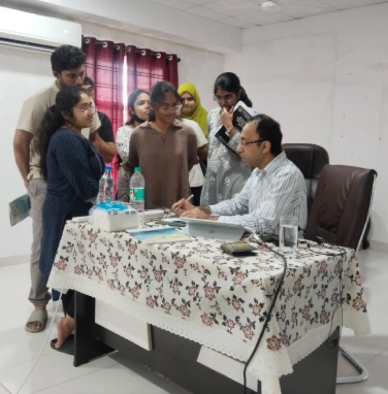 Students with a mentor in a small-group session at the centre